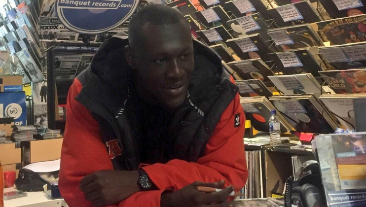 Stormzy, now a local resident of Kingston, behind the counter at Banquet