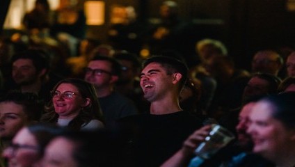 Audience members laughing at the Comedy acts