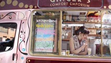 Lady leaning out of an icecream van