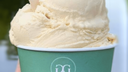 A green tub of vanilla icecream