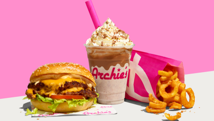 burger, milshake and fried on a bright pink background