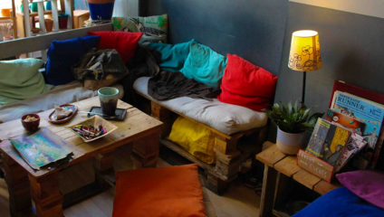 Cosy corner at Red Fish, with handmade crockery and art supplies.