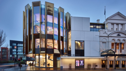 The exterior of Theatre Royal Glasgow; left of the original Edwardian building stands the highly modern glass-panelled cylinder built around the central staircase