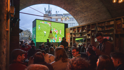 Image of rugby fans at Flat Iron Square, Southwark, watching the Six Nations