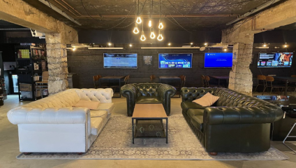 Inside the Loading Bar showing video games and lounge area
