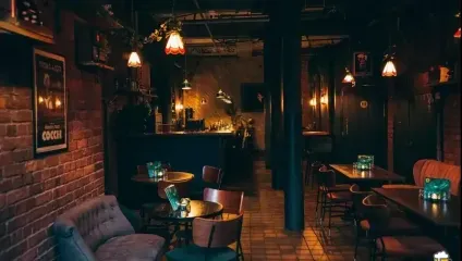 a dimly lit cocktail basement bar