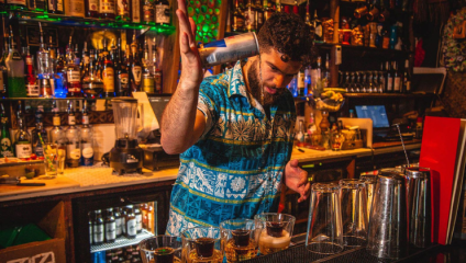 Image of a bartender pouring jagerbombs at Sugar Cane cocktail bar, Clapham