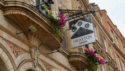 Outside the Drayton Arms, Victorian architecture and black and white pub sign