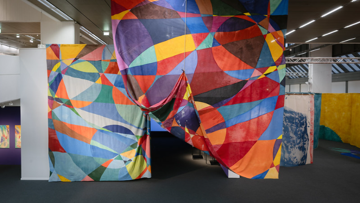 Image: Ulla von Brandenburg, installation view Thoughts Are Things (Day and Night), 2024 -25, assembled painted fabrics, dimensions variable.  Photo: Christian Kleiner. Courtesy the artist and Wilhelm-Hack-Museum, Ludwigshafen.