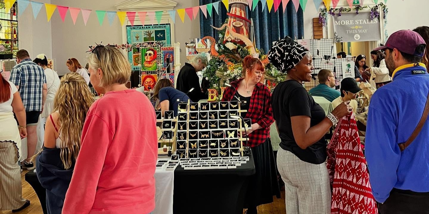 Shoppers browsing handmade crafts, jewellery and art at Beau Events Makers Market in Brighton, a lively community event featuring local creators and independent traders.