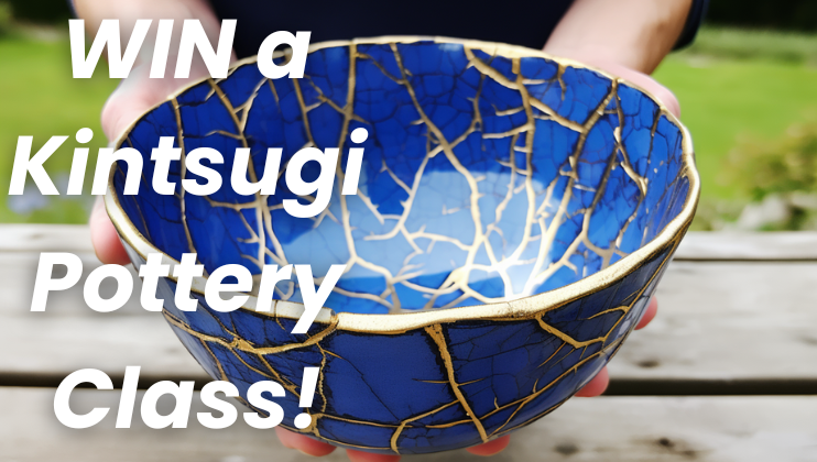Hands holding a repaired blue pottery bowl with gold cracks, showcasing the Kintsugi technique. The text overlays the image, reading, WIN a Kintsugi Pottery Class! The background appears to be an outdoor setting with greenery.
