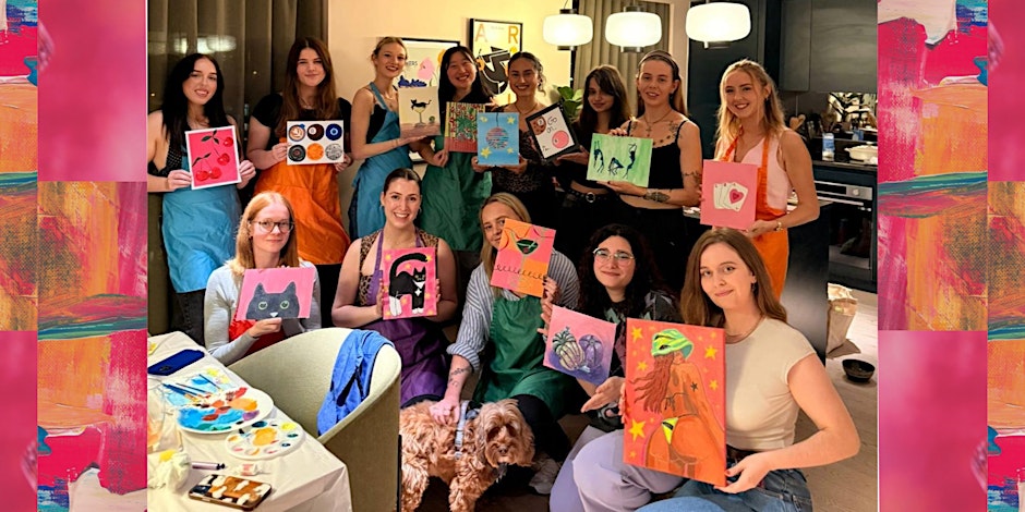 A group of smiling young artists hold colourful acrylic paintings after a painting workshop.