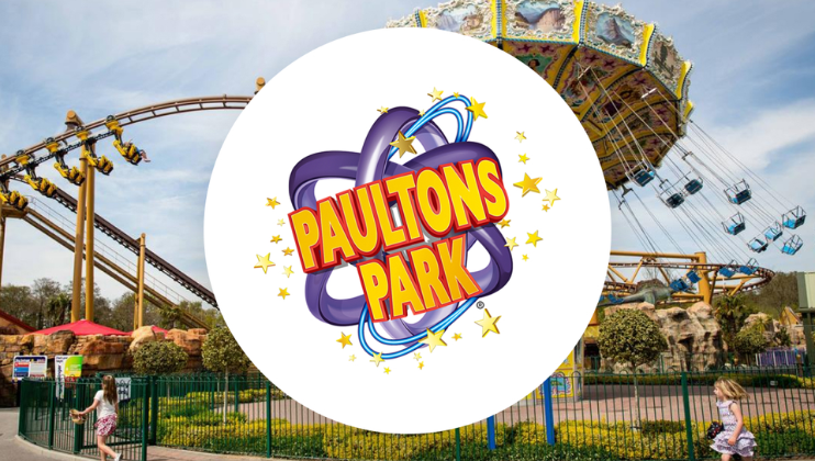 The Paultons Park logo superimposed onto a photograph of the park, showing the Sky Swinger ride