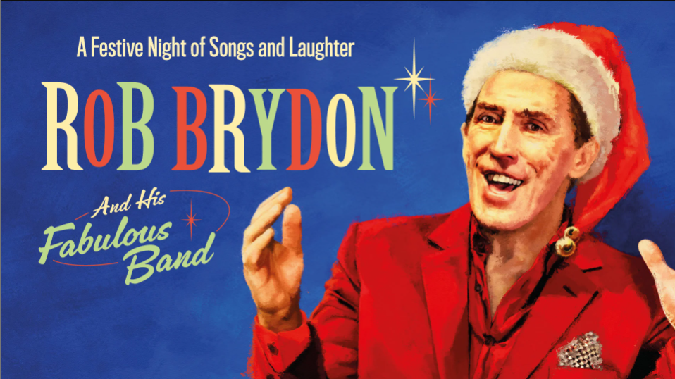 An illustration of Rob Brydon in a Santa hat and a red suit with arms outstretched and an open smile on a textured blue background. Text reads