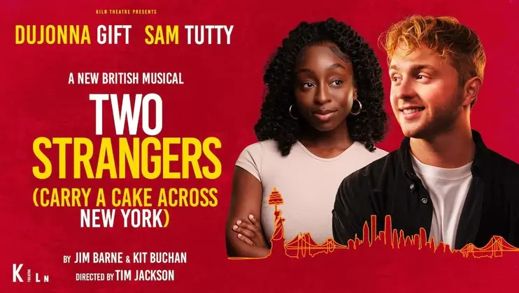 The image shows a poster for the musical Two Strangers (Carry a Cake Across New York) featuring headshots of two actors, Dujonna Gift and Sam Tutty, against a red background. The bottom includes credits for creators Jim Barne and Kit Buchan, and director Tim Jackson.