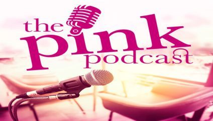 A promotional image for The Pink Podcast featuring a pink microphone icon and text against a blurred background of pink chairs and a table. In the foreground, another microphone is visible on a stand.