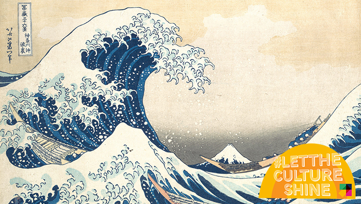 A traditional Japanese ukiyo-e woodblock print of a large wave crashing with boats caught in the swell. Mount Fuji is visible in the background. The image includes the text #LETTHECULTURESHINE on an orange shape in the lower right corner.