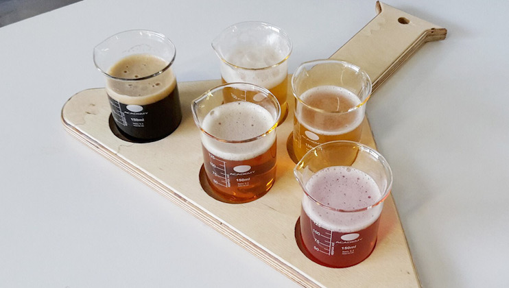 Platter with tasting glasses of craft beer