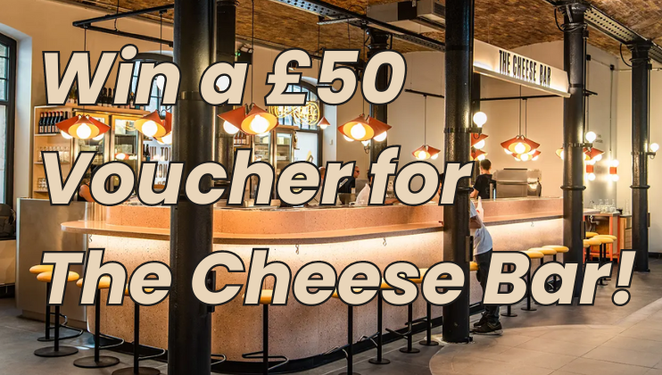 A modern restaurant interior with a long, curving bar counter, high stools, and hanging lights. Text overlay reads Win a £50 Voucher for The Cheese Bar!.