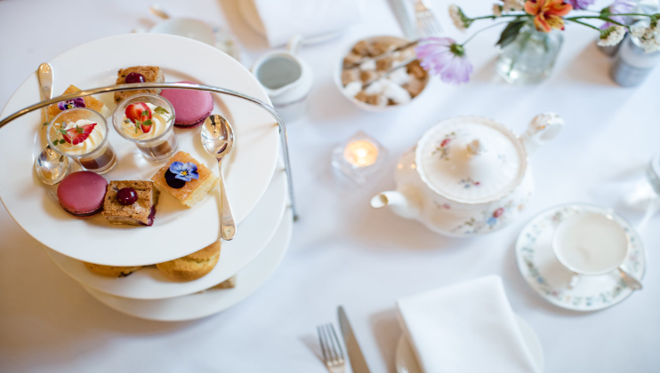 image of afternoon tea at Berwick Lodge Bristol, cakes on a stand & a teapot
