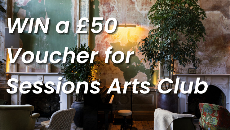 A rustic room with distressed walls and lush green plants. Text in the image reads WIN a £50 Voucher for Sessions Arts Club in bold white letters. The room has a serene ambiance with a piano, comfortable chairs, and a fireplace adorned with decorative items.